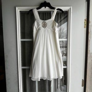 A never been worn size 8 short ivory dress.